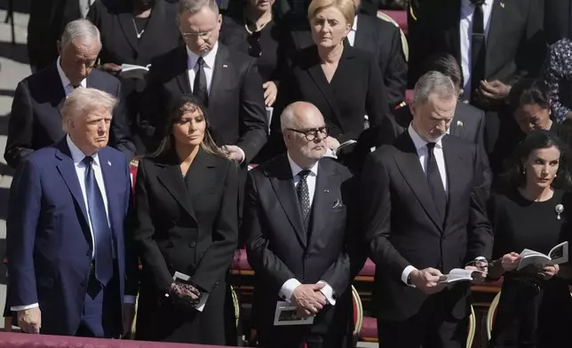 Front row left to right, President Donald Trump, first lady Melania Trump, Estonia's President Alar Karis, Spain's King Felipe VI and Spain's Queen Letizia attend the funeral of Pope Francis in St. Peter's Square at the Vatican, Saturday, April 26, 2025. (AP Photo/Markus Schreiber)