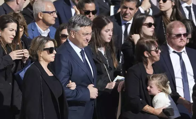 Croatia's Prime Minister Andrej Plenkovic, center left, arrives for the funeral of Pope Francis in St. Peter's Square at the Vatican, Saturday, April 26, 2025. (AP Photo/Markus Schreiber)