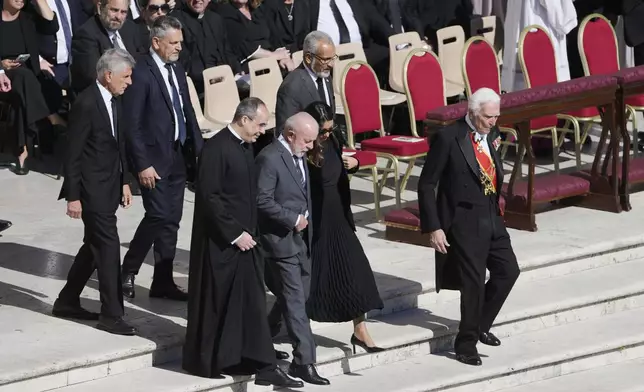 Brazil's President Luiz Inacio Lula da Silva, center, and Brazil's first lady Janja Lula da Silva arrive for the funeral of Pope Francis in St. Peter's Square at the Vatican, Saturday, April 26, 2025. (AP Photo/Markus Schreiber)