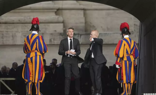 Emanuele Filiberto of Savoy, second left, arrives for the funeral of Pope Francis in St. Peter's Square at the Vatican, Saturday, April 26, 2025. (AP Photo/Alessandra Tarantino)