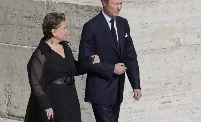 Luxembourg's Grand Duke Henri and Grand Duchess Maria Teresa arrive for the funeral of Pope Francis in St. Peter's Square at the Vatican, Saturday, April 26, 2025. (AP Photo/Gregorio Borgia)