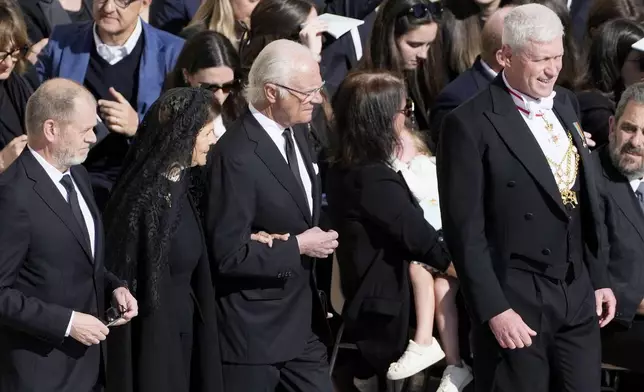 Sweden's King Carl XVI Gustaf, center, and Sweden's Queen Silvia, second left, arrive for the funeral of Pope Francis in St. Peter's Square at the Vatican, Saturday, April 26, 2025. (AP Photo/Markus Schreiber)