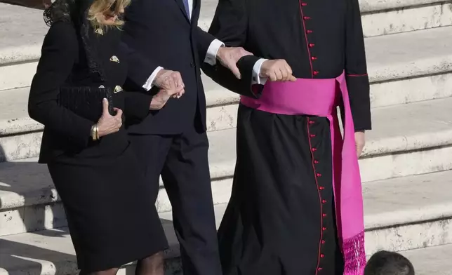 Former President Joe Biden, center, and his wife Jill arrive for the funeral of Pope Francis in St. Peter's Square at the Vatican, Saturday, April 26, 2025. (AP Photo/Gregorio Borgia)