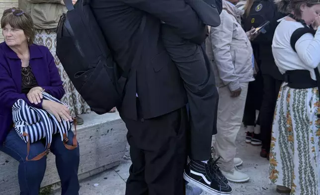 Julian Assange attends the funeral of Pope Francis in St. Peter's Square at the Vatican, Saturday, April 26, 2025. (Giusi Brega/LaPresse via AP)