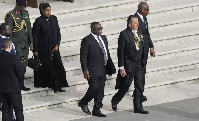 Sierra Leone President Julius Maada Bio, center, arrives for the funeral of Pope Francis in St. Peter's Square at the Vatican, Saturday, April 26, 2025. (AP Photo/Gregorio Borgia)