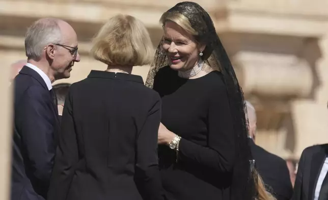 Queen Mathilde of Belgium, right, arrives for the funeral of Pope Francis in St. Peter's Square at the Vatican, Saturday, April 26, 2025. (AP Photo/Alessandra Tarantino)