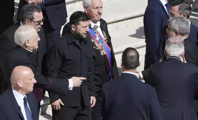 Ukraine's President Volodymr Zelenskyy, center, arrives for the funeral of Pope Francis in St. Peter's Square at the Vatican, Saturday, April 26, 2025. (AP Photo/Markus Schreiber)