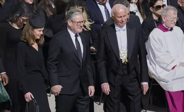 British Prime Minister Keir Starmer, center, and his wife Victoria arrive for the funeral of Pope Francis in St. Peter's Square at the Vatican, Saturday, April 26, 2025. (AP Photo/Gregorio Borgia)