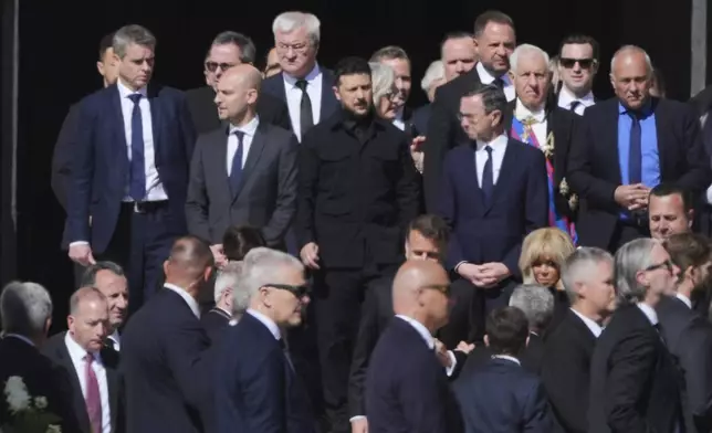 Ukraine's President Volodymr Zelenskyy, center, and other guests arrive, for the funeral of Pope Francis in St. Peter's Square at the Vatican, Saturday, April 26, 2025. (AP Photo/Andrew Medichini)