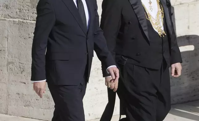 Cypriot President Nikos Christodoulides, left, arrives for the funeral of Pope Francis in St. Peter's Square at the Vatican, Saturday, April 26, 2025. (AP Photo/Markus Schreiber)