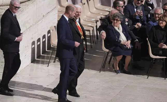 Britain's Prince William, center, arrives for the funeral of Pope Francis in St. Peter's Square at the Vatican, Saturday, April 26, 2025. (AP Photo/Evan Vucci)