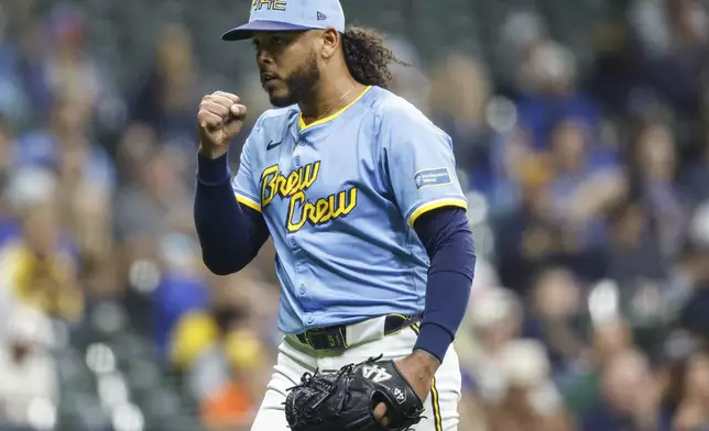 Milwaukee Brewers starting pitcher Freddy Peralta reacts after the final out during the fifth inning of a baseball game against the Athletics, Friday, April 18, 2025, in Milwaukee. (AP Photo/Jeffrey Phelps)