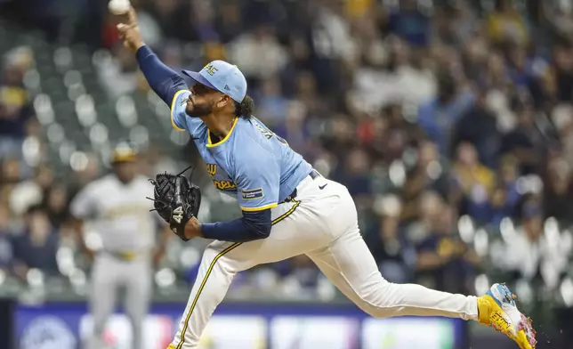 Milwaukee Brewers pitcher Freddy Peralta throws to the Athletics in the first inning of a baseball game Friday, April 18, 2025, in Milwaukee. (AP Photo/Jeffrey Phelps)