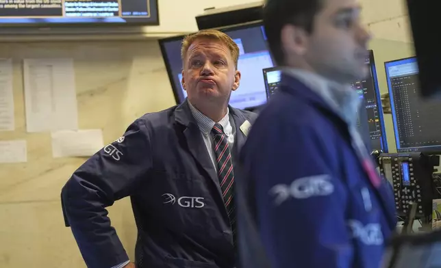 John Bowers works on the floor at the New York Stock Exchange in New York, Wednesday, April 9, 2025. (AP Photo/Seth Wenig)