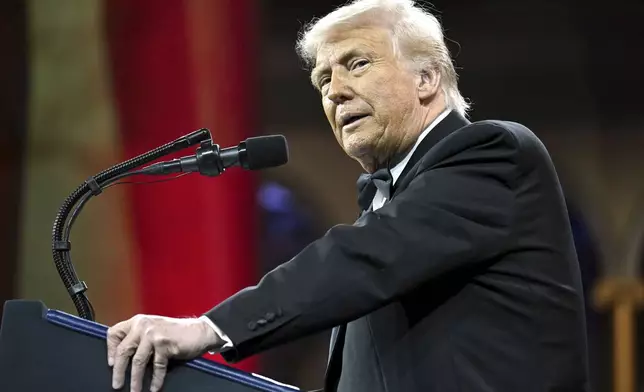 President Donald Trump speaks at the National Republican Congressional Committee (NRCC) dinner at the National Building Museum in Washington, Tuesday, April 8, 2025. (Pool via AP)