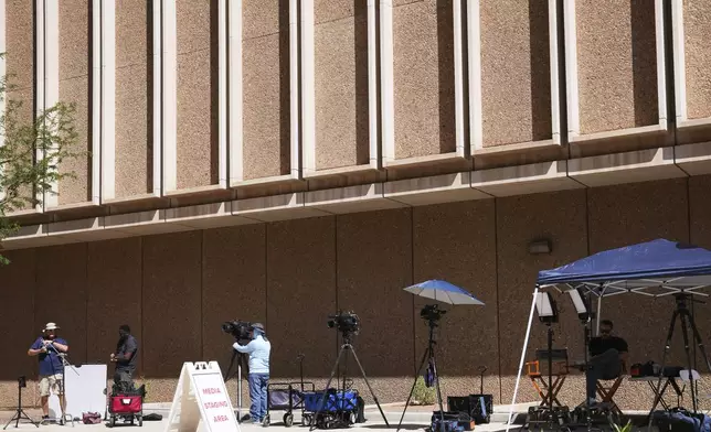 The assembled media are set up for live shots in front of Maricopa County Courthouse where the murder trial of Lori Vallow Daybell, who is charged with conspiring to murder her estranged husband, is being held Monday, April 21, 2025, in Phoenix. (AP Photo/Ross D. Franklin)