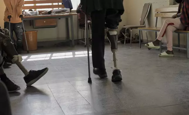 Wounded Tigrayan former combatant learn to walk on a prosthesis during a visit at Ortho-Physiotherapy Centre at Mekele in Tigray region of northern Ethiopia Friday, Feb. 14, 2025. (AP Photo/Amanuel Birhane)