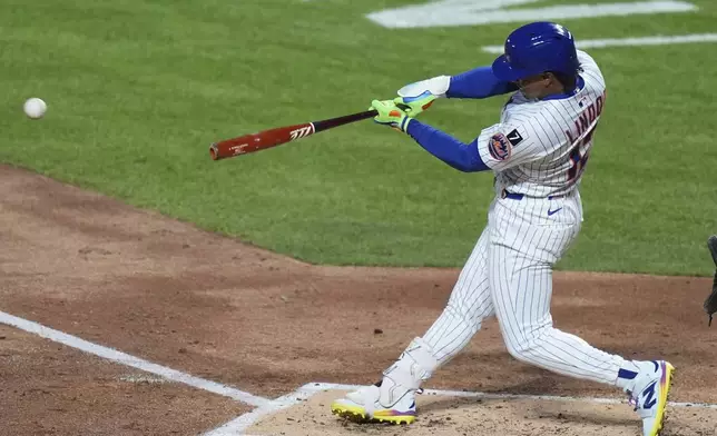 New York Mets' Francisco Lindor (12) hits an RBI single during the second inning of a baseball game against the St. Louis Cardinals Thursday, April 17, 2025, in New York. (AP Photo/Frank Franklin II)