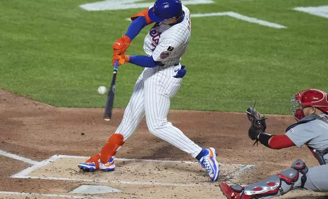 New York Mets' Brett Baty hits an RBI single during the second inning of a baseball game against the St. Louis Cardinals Thursday, April 17, 2025, in New York. (AP Photo/Frank Franklin II)