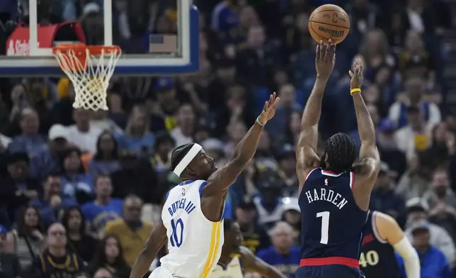 Los Angeles Clippers guard James Harden (1) shoots a 3-point basket over Golden State Warriors forward Jimmy Butler III during the first half of an NBA basketball game Sunday, April 13, 2025, in San Francisco. (AP Photo/Godofredo A. Vásquez)
