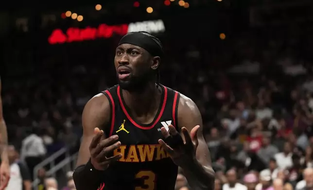 Atlanta Hawks guard Caris LeVert (3) reacts to a referee in the first half of an NBA play-in tournament basketball game against the Miami Heat, Friday, April 18, 2025, in Atlanta. (AP Photo/Brynn Anderson)