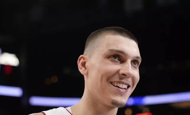 Miami Heat guard Tyler Herro (14) reacts to a win against the Atlanta Hawks after an NBA play-in tournament basketball, Friday, April 18, 2025, in Atlanta. (AP Photo/Brynn Anderson)