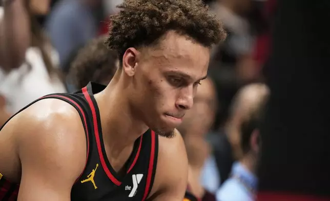Atlanta Hawks guard Dyson Daniels (5) reacts to a loss on the bench in overtime of an NBA play-in tournament basketball game against the Miami Heat, Friday, April 18, 2025, in Atlanta. (AP Photo/Brynn Anderson)