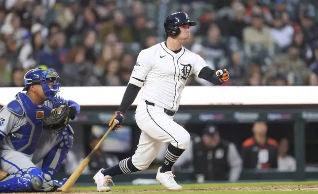 Detroit Tigers' Kerry Carpenter hits a double against the Kansas City Royals in the fifth inning during a baseball game, Thursday, April 17, 2025, in Detroit. (AP Photo/Paul Sancya)
