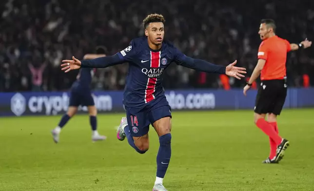PSG's Desire Doue celebrates after scoring his side's first goal during the Champions League quarterfinal first leg soccer match between Paris Saint-Germain and Aston Villa at Parc des Princes stadium in Paris, Wednesday, April 9, 2025. (AP Photo/Aurelien Morissard)
