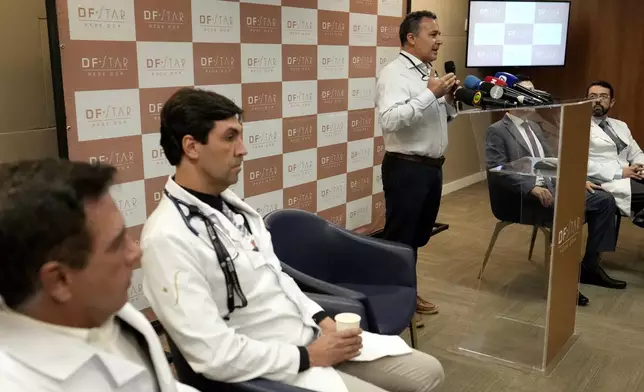 Doctor Claudio Birolini talks about the abdominal surgery on former President Jair Bolsonaro at DF Star Hospital in Brasilia, Brazil, Monday, April 14, 2025. (AP Photo/Eraldo Peres)
