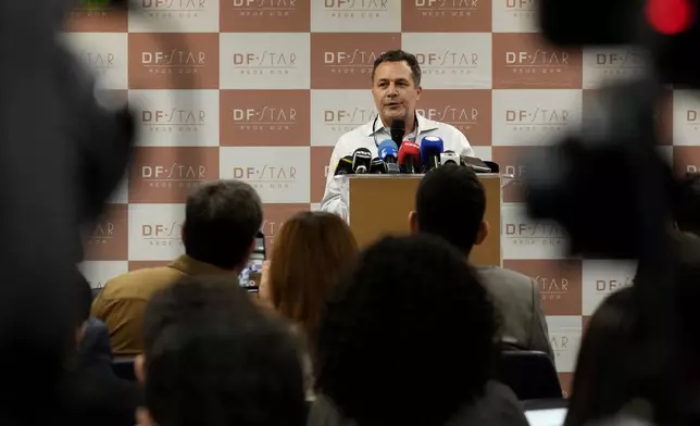 Doctor Claudio Birolini talks about the abdominal surgery on former President Jair Bolsonaro at DF Star Hospital in Brasilia, Brazil, Monday, April 14, 2025. (AP Photo/Eraldo Peres)