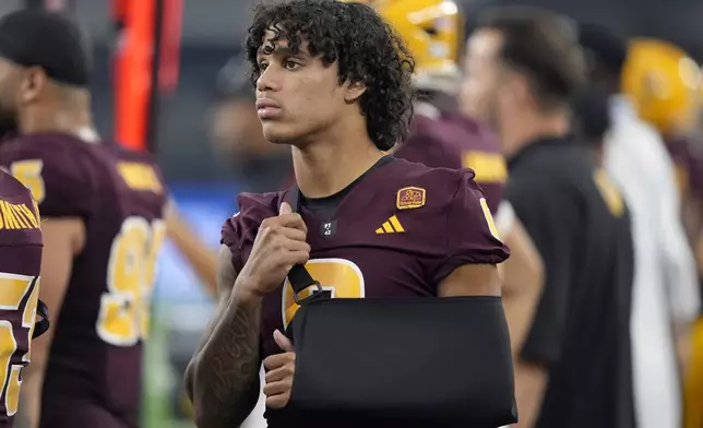 FILE - Arizona State wide receiver Jordyn Tyson (0) watches play against Iowa State in the second half of the Big 12 Conference championship NCAA college football game, in Arlington, Texas, Saturday Dec. 7, 2024. (AP Photo/LM Otero, File)