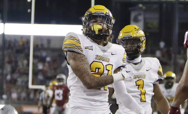 FILE -Idaho wide receiver Jordan Dwyer (21) celebrates his touchdown during the second half of the team's NCAA college football game against Washington State, Saturday, Sept. 3, 2022, in Pullman, Wash. Washington State won 24-17. (AP Photo/Young Kwak, File)