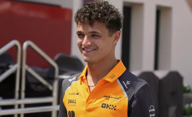 McLaren driver Lando Norris of Britain arrives for the first practice during the Formula One 2025 Bahrain Grand Prix, in Sakhir, Friday, April 11, 2025. (AP Photo/Darko Bandic)