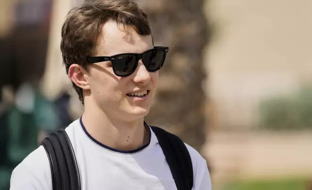 McLaren driver Oscar Piastri of Australia walks through the paddock ahead of the Formula One Bahrain Grand Prix at the Bahrain International Circuit in Sakhir, Thursday, April 10, 2025. (AP Photo/Darko Bandic)