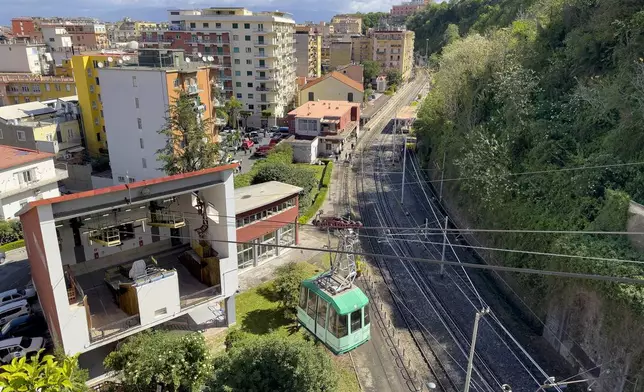View of the Monte Faito cable car departure station in Castellammare di Stabia near Naples, southern Italy, Friday, April 18, 2025, with the cabin from which nine passengers were rescued when the traction cable broke Thursday, killing four people in another cabin that fell further up the mountain. (AP Photo/Salvatore Laporta)