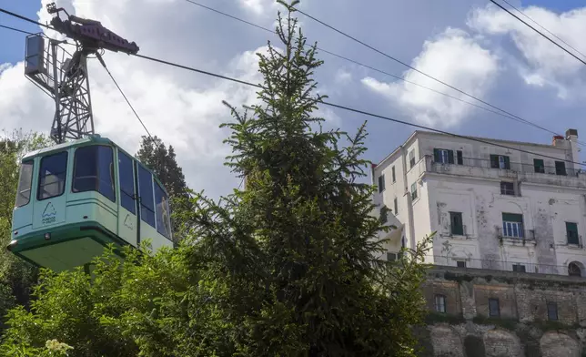 View of the Monte Faito cable car departure station in Castellammare di Stabia near Naples, southern Italy, Friday, April 18, 2025, with the cabin from which nine passengers were rescued when the traction cable broke Thursday, killing four people in another cabin that fell further up the mountain. (AP Photo/Salvatore Laporta)
