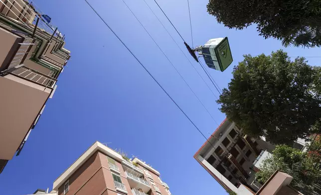 View of the Monte Faito cable car departure station in Castellammare di Stabia near Naples, southern Italy, Friday, April 18, 2025, with the cabin from which nine passengers were rescued when the traction cable broke Thursday, killing four people in another cabin that fell further up the mountain. (AP Photo/Salvatore Laporta)