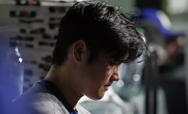 Los Angeles Dodgers designated hitter Shohei Ohtani (17) sits in the dugout during the eighth inning of a baseball game against the Chicago Cubs, Tuesday, April 22, 2025, in Chicago. (AP Photo/Erin Hooley)