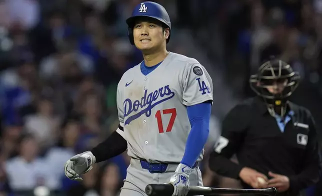 Los Angeles Dodgers designated hitter Shohei Ohtani (17) reacts after striking out during the first inning of a baseball game against the Chicago Cubs, Tuesday, April 22, 2025, in Chicago. (AP Photo/Erin Hooley)
