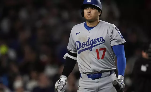 Los Angeles Dodgers designated hitter Shohei Ohtani (17) reacts to striking out during the eighth inning of a baseball game against the Chicago Cubs, Tuesday, April 22, 2025, in Chicago. (AP Photo/Erin Hooley)