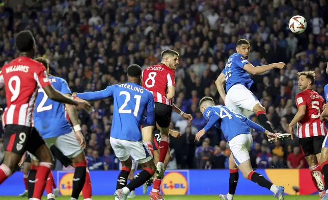 Athletic Bilbao's Oihan Sancet, center, heads the ball during the UEFA Europa League quarterfinal, first leg soccer match between Rangers and Athletic Bilbao at Ibrox Stadium, Glasgow, Scotland, Thursday April 10, 2025. (Steve Welsh/PA via AP)