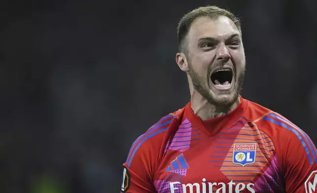 Lyon's goalkeeper Lucas Perri reacts after Rayan Cherki scored his side's second goal during the Europa League quarterfinal first leg soccer match between Lyon and Manchester United at Groupama stadium in Decines, outside Lyon, France, Thursday, April 10, 2025. (AP Photo/Thibault Camus)