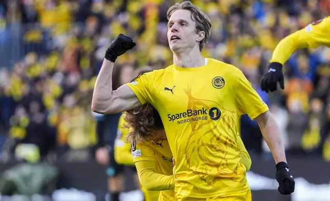 Bodø/Glimt's Ulrik Saltnes celebrates after scoring the opening goal during the Europa League quarterfinal soccer match between Bodø/Glimt and Lazio at Aspmyra Stadium in Bodø, Norway, Thursday, April 10, 2025. (Lise Åserud/NTB via AP)