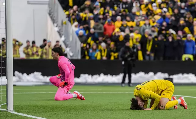 Bodø/Glimt's Ole Didrik Blomberg, right, and Lazio's goalkeeper Christos Mandas react during the Europa League quarterfinal soccer match between Bodø/Glimt and Lazio at Aspmyra Stadium in Bodø, Norway, Thursday, April 10, 2025. (Lise Åserud/NTB via AP)