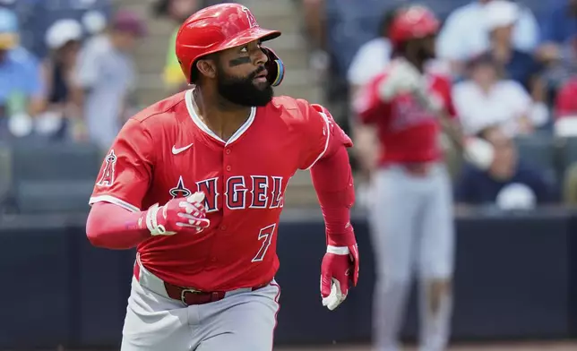 Los Angeles Angels' Jo Adell watches his home run off Tampa Bay Rays pitcher Zack Littell during the fifth inning of a baseball game Thursday, April 10, 2025, in Tampa, Fla. (AP Photo/Chris O'Meara)
