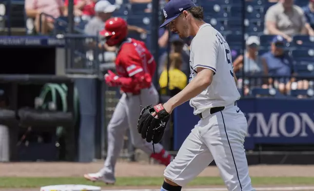 Tampa Bay Rays pitcher Mason Englert (59) walks back to the mound as Los Angeles Angels' Jo Adell runs around the bases after his home run during the fifth inning of a baseball game Thursday, April 10, 2025, in Tampa, Fla. (AP Photo/Chris O'Meara)