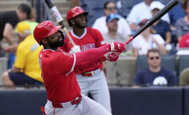 Los Angeles Angels' Jo Adell watches his solo home run off Tampa Bay Rays pitcher Zack Littell during the fifth inning of a baseball game Thursday, April 10, 2025, in Tampa, Fla. (AP Photo/Chris O'Meara)