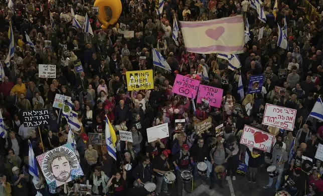 People take part in a protest demanding the immediate release of hostages held by Hamas in the Gaza Strip, in Tel Aviv, Israel, Saturday, April 5,2025. (AP Photo/Ariel Schalit)