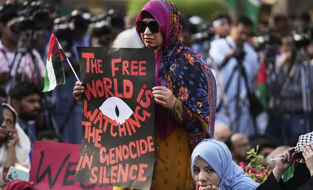 Supporters of the Pakistani religious group "Jamaat-e-Islami" take part in a rally against Israeli airstrikes and to show solidarity with Palestinian people living in Gaza, in Lahore, Pakistan Friday, April 11, 2025. (AP Photo/K.M. Chaudary)
